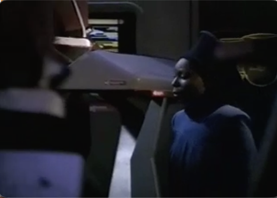 Guinan vists the bridge of the Alt-Enterprise-D which looks sort of like a bowling alley during Cosmic Bowling Night.