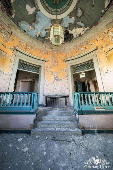 entrance with turquoise bannisters