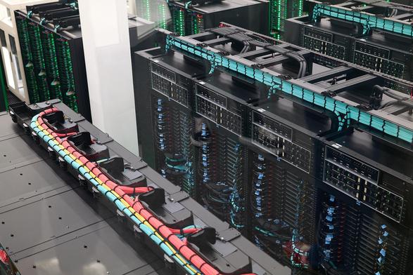 Barcelona Supercomputing Centre - MareNostrum5 - showing storage nodes in server cabinets. Colour coded wiring - blue for Storage node, Red for computation node, yellow for networking (if I remember correctly)