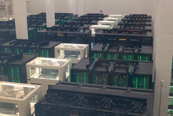 MareNostrum5 supercomputer - server cabinets, cooling nodes, all arranged in rows and columns.