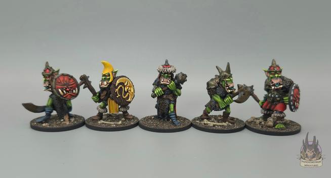 5 very happy orcs with various swords, clubs, axes and maces