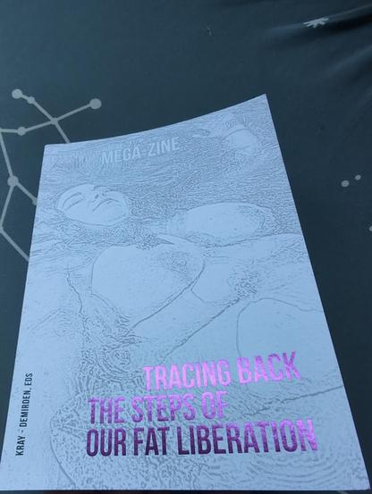 Image of a white book with a light gray drawing of a fat person's silhouette floating in water. The title is sparkling pink and called Tracing back the steps of our fat liberation.