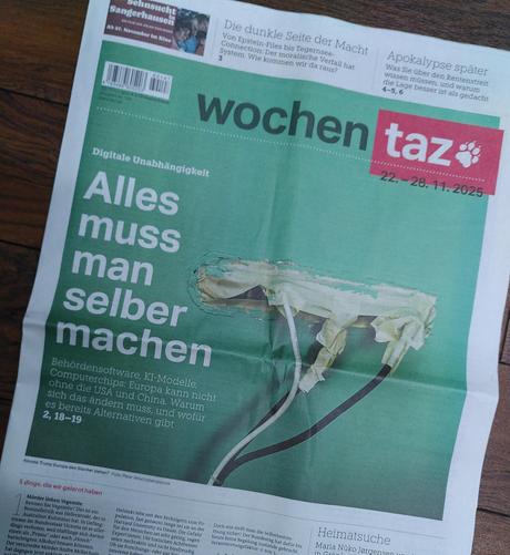 Foto einer taz Titelseite, Das Titelfoto zeigt eine grün gestrichene Wand, aus der ein paar unprofessionell verklebte Netzwerkkabel herauskommen.
