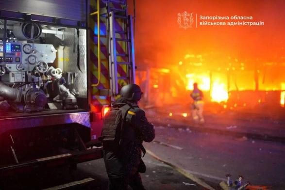 Emergency workers respond to a burning building after a Russian attack on Zaporizhzhia in fall 2025
