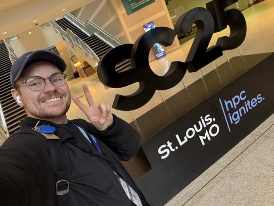 Selfie of yours truly in front of the supercomputing 2025 sign in saint Louis