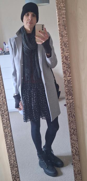 Non Binary person in an autumnal outfit