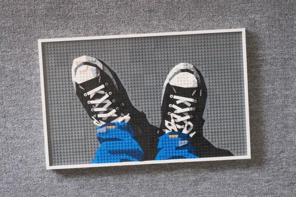 A piece of Lego art depicting a pair of canvas sneakers