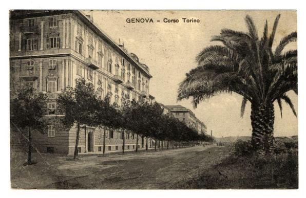 The image depicts a historical black and white photograph showing an urban scene. It is labeled "GENOVA - Corso Torino" at the top, indicating that it's of Genoa (Genova) along its main street known as Corso Torino.

In this photo, there are multiple five-story buildings with large windows on their facades, characteristic of European architecture from a bygone era. The building to the left appears more aged and has balconies where individuals can be seen in some of them. A palm tree is prominently featured on the right side of the street, suggesting that this area might have been cultivated for its aesthetic appeal or as part of urban planning.

The streetscape shows a wide boulevard with what seems like tram tracks embedded into it at regular intervals. The road appears to be paved and has very few vehicles visible in the distance. Sidewalks line both sides of the street, and there are trees planted along them, providing greenery amidst the stone buildings.

Overall, this image conveys a sense of historical urban life with its architectural features and public amenities such as tree-lined streets for beautification or shade.