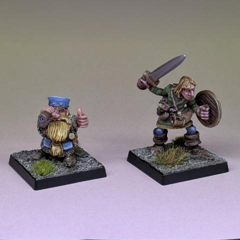 A dwarf with telescope and a human with Sword and shield