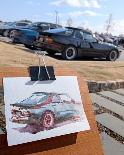 Photo of the Porsche sketch with the subject in view behind