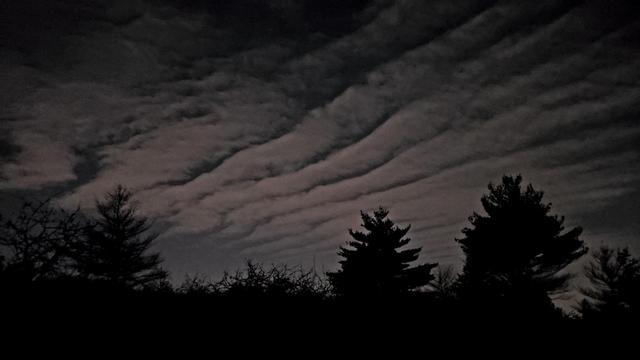 A cloud formation illuminated by light pollution viewed from the top of Buck Hill.