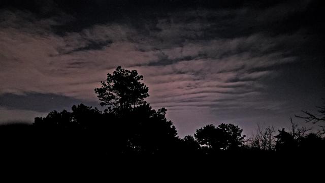A cloud formation illuminated by light pollution viewed from the top of Buck Hill.