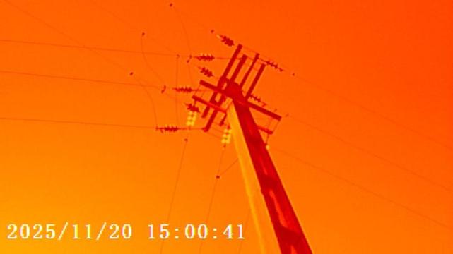 A red filtered image of an electricity pole taken with a Photo Creator Mini Cam.