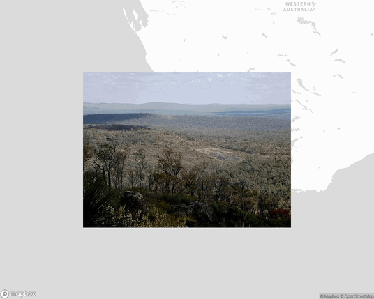 A photo of or from a national park from the linked website, overlaid on a cropped world map where it's located.