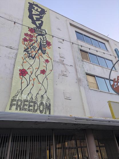 "fall of freedom" banner dropped on the front of the gizmo building, downtown albuquerque new mexico u.s.