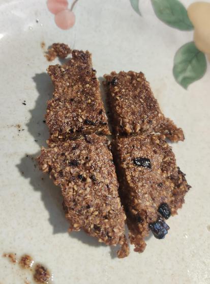 The same dough, cooked. It's a pleasant brown colour. There are some black spots that were bits of onion that were left over in the pan from lunch. Unlike my previous attempt, this one held together.