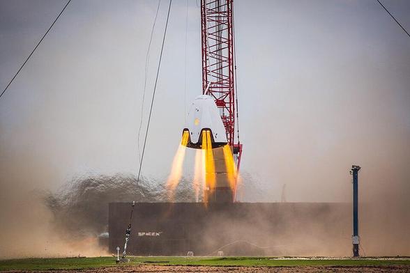 A full-size test article of the SpaceX Crew Dragon named DragonFly fires its eight SuperDraco engines in a development test of its ability to land with the accuracy of a helicopter using only the thrusters. The company conducted two tethered tests vehicle attached to a crane so engineers could refine the landing software and systems on the spacecraft. SpaceX envisions returning people to Earth from space on the power of thrust instead of beneath parachutes. SpaceX, in partnership with NASA’s Commercial Crew Program, is developing the Crew Dragon and Falcon 9 integrated system to take astronauts to launch astronauts to the International Space Station from the United States.