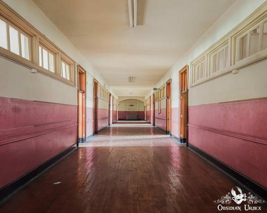 long corridor with pink walls