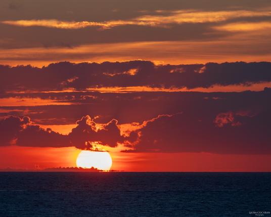 A color-rich sunset over the sea.