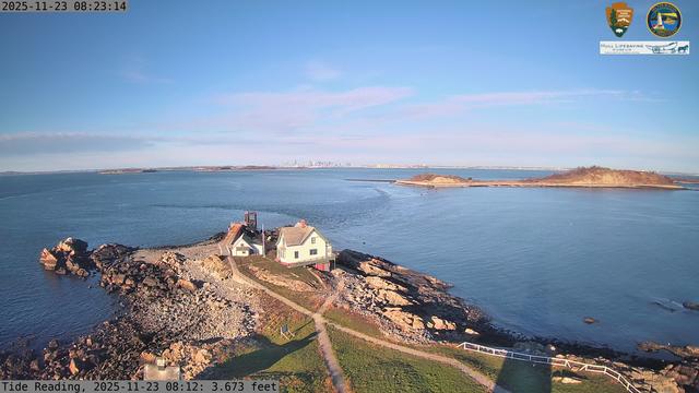 Camera looking west from Boston Light on Little Brewster Island. View looks toward downtown Boston in the distance, with several islands including Great Brewster and Georges Island in the midground.