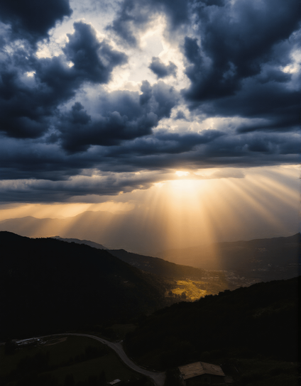 The image captures a dramatic landscape where dark, brooding clouds loom above a serene valley illuminated by shafts of golden sunlight breaking through the clouds. The interplay of light and shadow creates a breathtaking contrast, enhancing the natural beauty of the scene. The mountains in the background add depth, while the winding road hints at a journey through this tranquil yet awe-inspiring setting.
"Das Bild zeigt eine dramatische Landschaft, in der dunkle, drohende Wolken über einem ruhigen Tal schweben, das von strahlenden Sonnenstrahlen erleuchtet wird, die durch die Wolken brechen. Das Wechselspiel von Licht und Schatten schafft einen atemberaubenden Kontrast und hebt die natürliche Schönheit der Szene hervor. Die Berge im Hintergrund verleihen Tiefe, während die sich schlängelnde Straße auf eine Reise durch dieses ruhige und zugleich beeindruckende Setting hinweist."