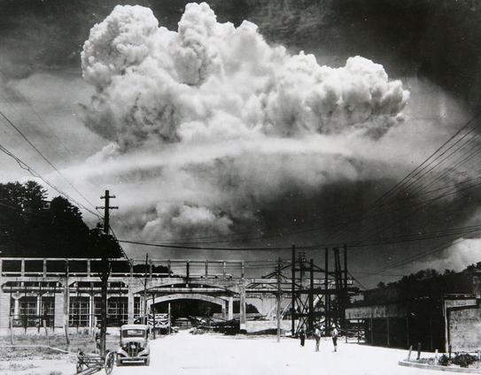 Mushroom cloud in the distance over Nagasaki.
