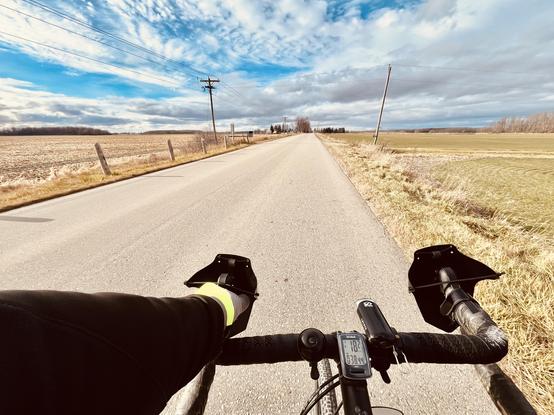 Same as prior frame but w/ inclusion of hands and bars and a surprisingly crisp sliver of the rubber up front, fresh from the road and headed straight back down. I track wheel cycles in my software: this trip about 28k turns.
