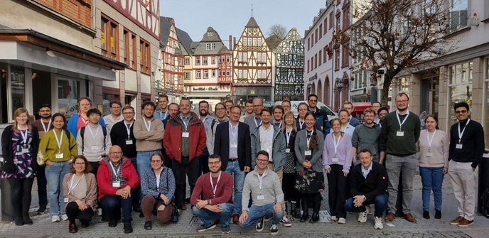 group picture of the participants of the 4th Ontologies4Chem Workshop in Limburg in front of historic houses of the Limburg historic city center.