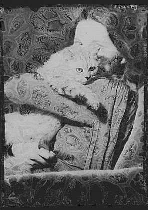 The image depicts a portrait of an individual with a cat, likely from the early to mid-20th century. The person is holding the cat in their arms and appears to be resting on a surface covered with ornate patterns or designs.

Arnold Genthe was known for his work as a photographer during that period, often capturing portraits and documenting notable figures of the time. This particular photograph seems to reflect Genthe's style of using dramatic lighting and contrast, which is evident in the strong shadows and highlights visible on both the subject and the cat.

The black-and-white color scheme adds an air of classic elegance to the image while also drawing attention to textures, shapes, and forms within it. The composition conveys a sense of intimacy between the person holding the cat and evokes feelings associated with tender moments shared among people who love animals.