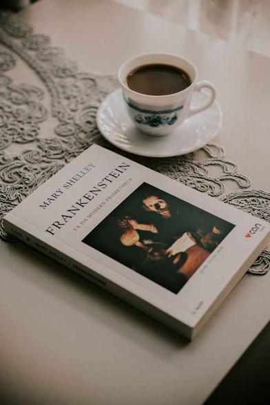 cozy reading with coffee and frankenstein book