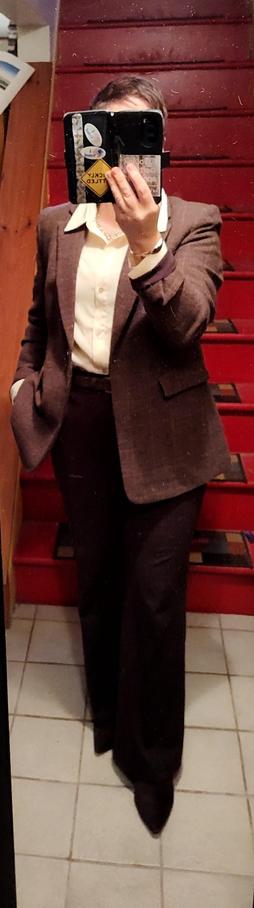 Butter yellow satin blouse, chocolate brown knit wide leg trousers. Brown wool check blazer. Chocolate brown suede belt and ankle boots. Minimal gold jewelry.