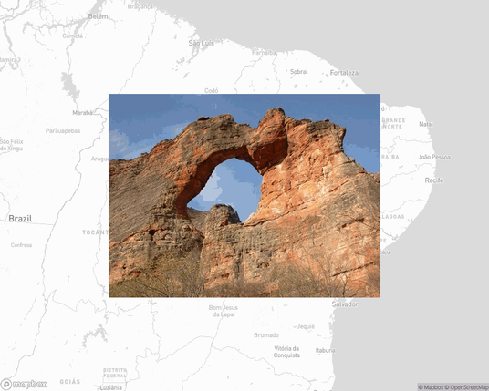 A photo of or from a national park from the linked website, overlaid on a cropped world map where it's located.