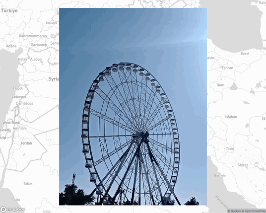 A photo of or from a park from the linked website, overlaid on a cropped world map where it's located.