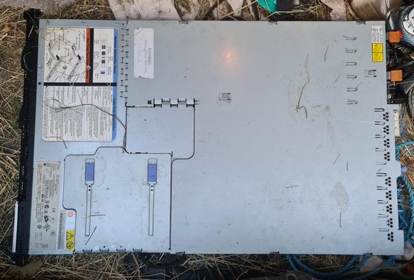 An old 1U IBM server lying on loads of rubbish in the boot of my car