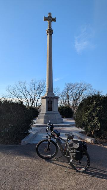 Black and red eBike in front of the Daughters of the American Revolution monument