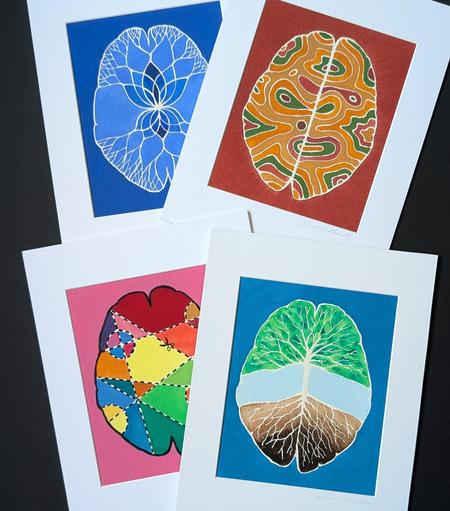 4 different watercolor paintings of brains