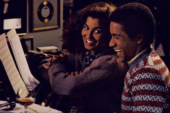 1983 Intimate Music Session

Two individuals deeply engaged in a musical collaboration, with sheet music and personal items suggesting an indoor setting.