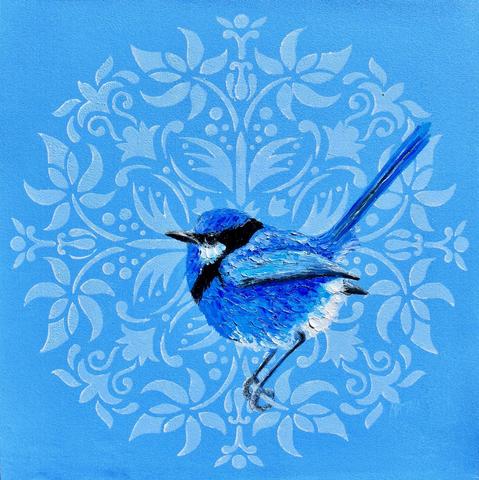A male Splendid Fairywren bird is perched on a decorative floral patterned background. The bird is light blue and dark blue and the background pattern is blue.