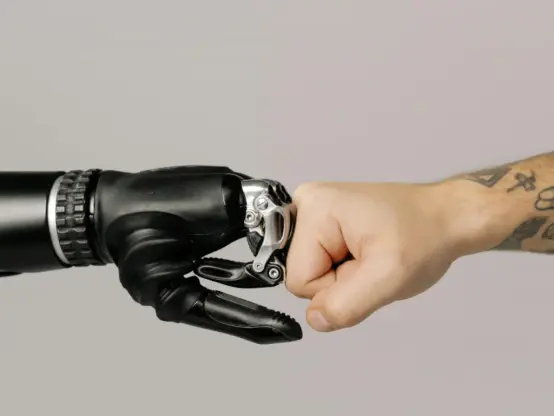 Human fist bumps robotic hand