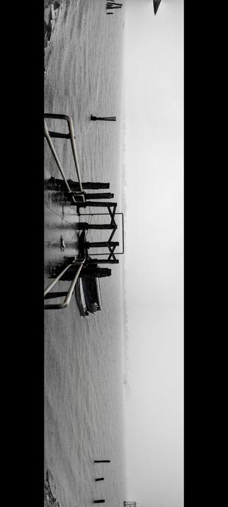 The photograph composed in monochrome, shows a shot of a structure at the river shore. It's a pier, constructed with multiple steel pilings extending into the water. No person is visible on the pier. The water surface is relatively calm, with subtle reflections. The mist is strong. The overall composition is symmetrical, creating a stark and minimalist aesthetic.

Provided by @altbot, generated privately and locally using Gemma3:27b

🌱 Energy used: 0.072 Wh