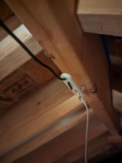 One end of the dipole showing the dipole insulator that I 3D printed. The wire is held in place with friction through the holes in the insulator.