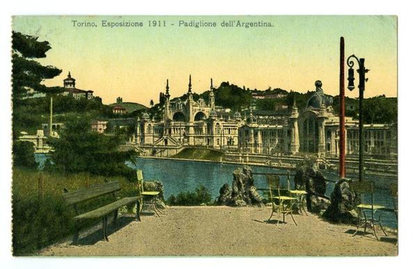 The image depicts a vintage postcard featuring the Argentine pavilion from an exhibition held in Turin, Italy, during 1911. The Argentine Pavilion is shown as part of the broader Torino Esposizione event. This particular structure appears to be ornate and historic with multiple levels and arches, suggesting significant architectural interest for its time.

The photo shows a serene setting by a body of water where the pavilion stands majestically against green hills in the background. There are several benches placed along what seems like a promenade or walkway leading towards the building. The colors on this postcard are somewhat faded with shades of yellow, brown, and blue dominating due to its aged appearance.

The text "Torino" at the top indicates Turin's location while "Esposizione 1911 - Padiglione dell'Argentina." informs us about the event date and pavilion being showcased. The word 'Argentine,' in particular stands out, identifying the nationality associated with this structure within the image.

The inclusion of an iron lamp post on the right suggests a well-maintained public space meant for visitors to relax and enjoy their surroundings at the exhibition site. This setting gives us insight into how such national pavilions were designed as focal points during international expositions, often incorporating elements that represented or celebrated each country's cultural heritage.

In summary, this image captures  [...]