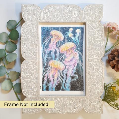 A very small drawing in colour of jellyfish swimming in the dark ocean. The jellyfish are in tones of blue, pink and yellow on an ocean background of dark blues. The drawing is in colour pencil.
An original art work, please note that the frame is not included.
Colour pencil on white acid free artist watercolour paper (postcard size).
Approximately 4 by 6 inches (10.16 x 15.24 cm) will fit into a standard 4 by 6 inch photo frame.