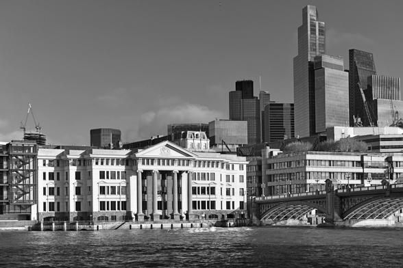 Monochrome photo of serviced offices completed 1993 by a consortium of developers, including the Vintners' livery company. Showing the Ionic-style façade to the river Thames. Not to be confused with the Vintners' Hall to which this building connects. City of London.