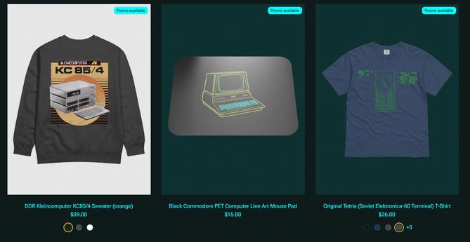 Screenshot of the store showing three articles:
A gray sweatshirt with an orange design of the KC 85/4 computer; A Mouse mat with line art of the Commodore PET computer
A blue T-shirt with the original TETRIS ASCII screen as it appeared on the Elektronica-60's terminal