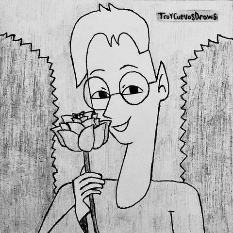 Hunter Scriver (the elven editor) holding a rose flower (possibly a Hunter rose) in front of two hedge bushes.