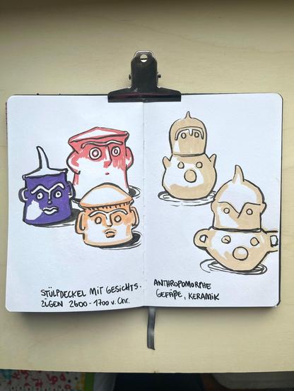 An open sketchbook with a multicoloured sketch of some ceramic vases with faces.