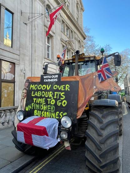 Cow-themed protest tractor with “MOOOV OVER LABOUR” sign in Westminster