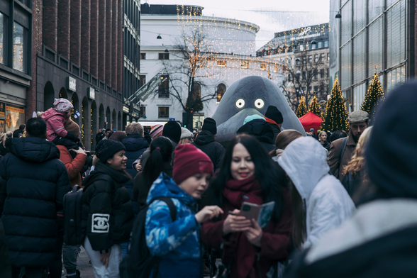 A groke in the crowded street of Helsinki