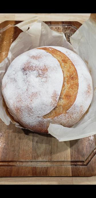 A loaf of sourdough bread fresh outta the oven.